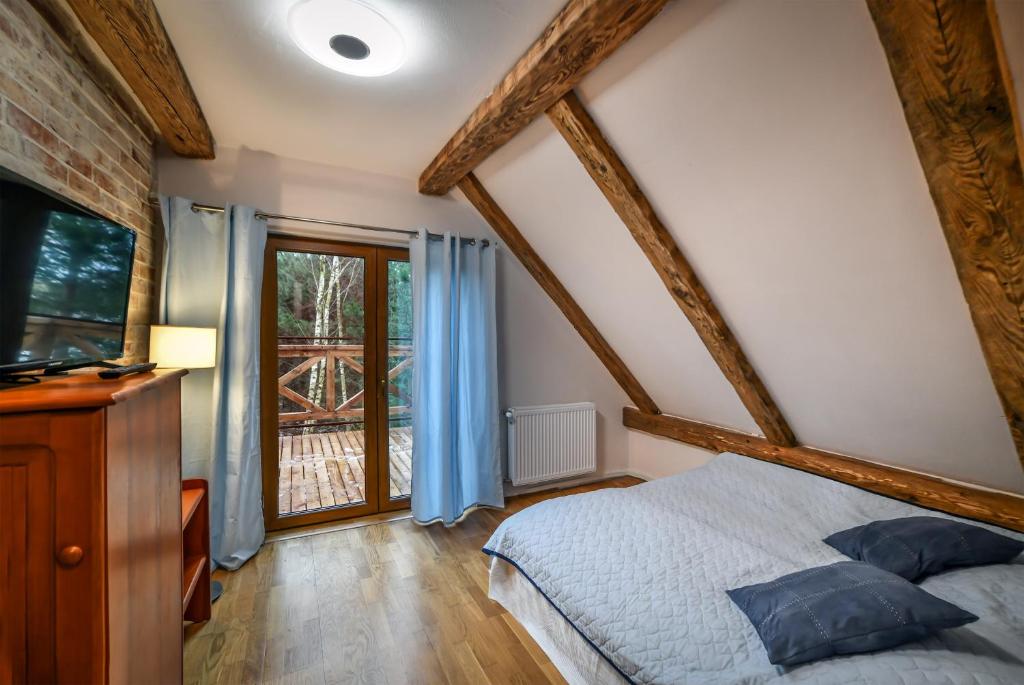 Postel nebo postele na pokoji v ubytování Apartamenty Dom Niezwykly