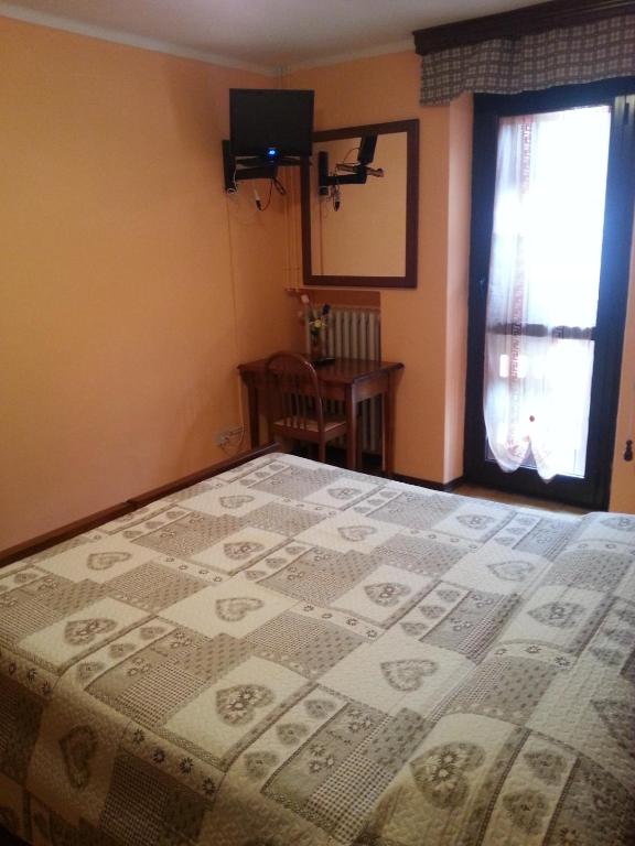 Postel nebo postele na pokoji v ubytování Chalet Monte Nebius