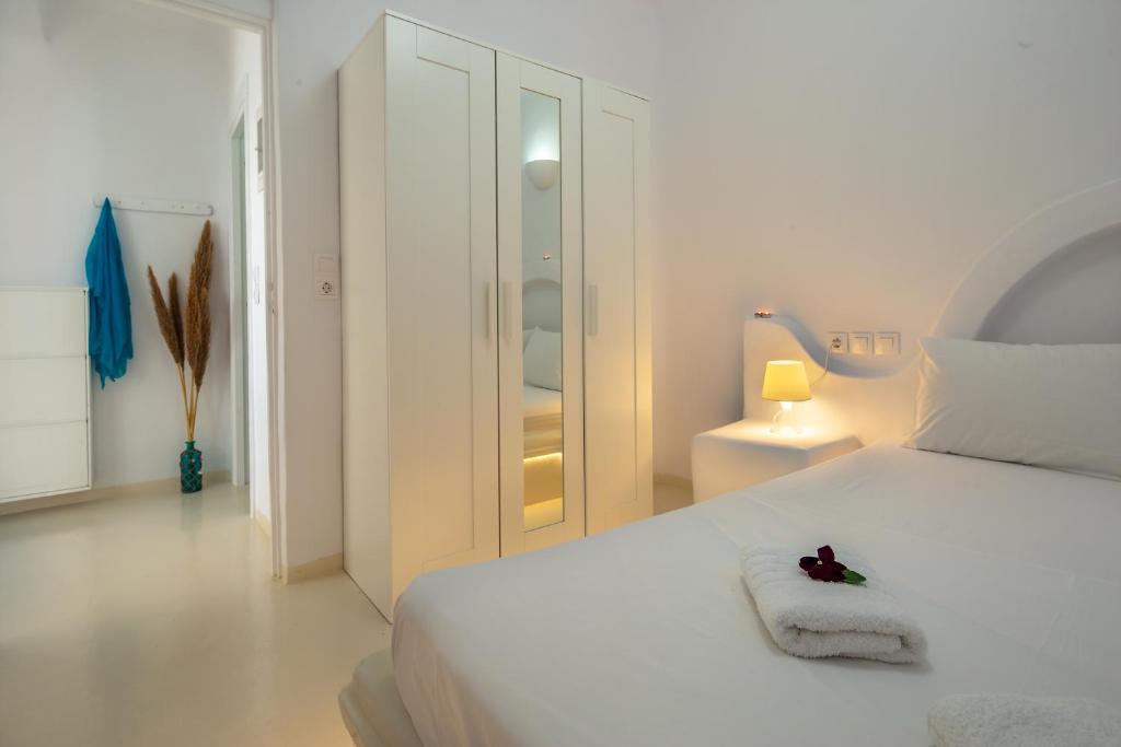 Posteľ alebo postele v izbe v ubytovaní Karystos Villas