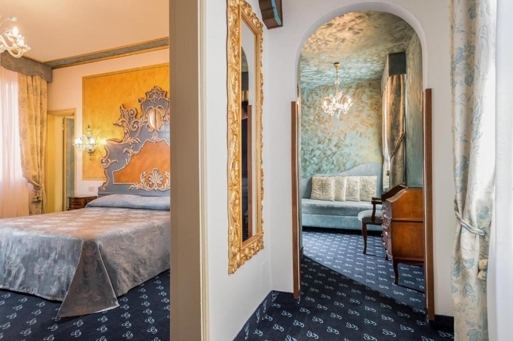 Postel nebo postele na pokoji v ubytování Hotel Giorgione