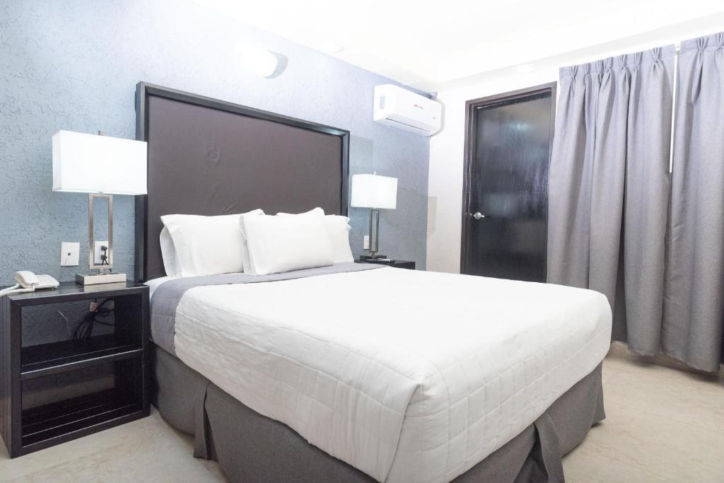 Postel nebo postele na pokoji v ubytování Hotel Ha