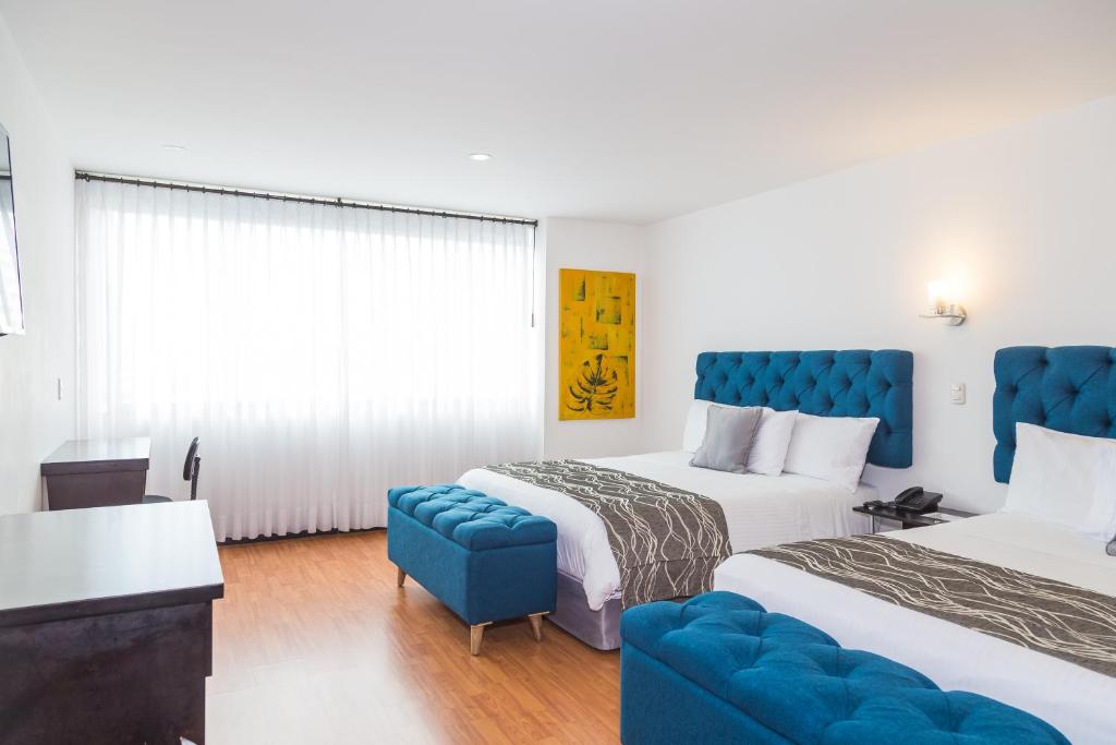 Postel nebo postele na pokoji v ubytování Hotel Varuna