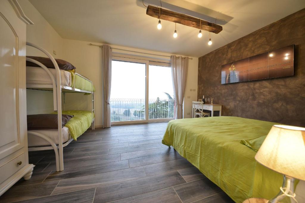 A bed or beds in a room at Agriturismo La Guarda