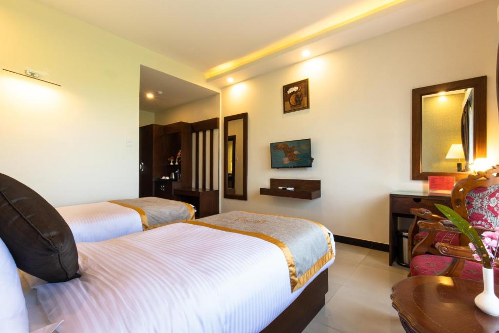 Rúm í herbergi á Hotel Ichchha
