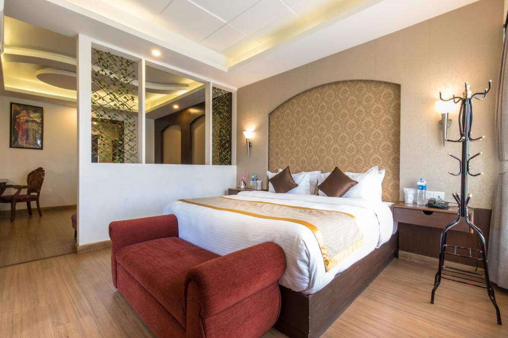 Rúm í herbergi á Hotel Ichchha