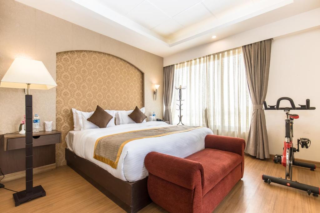 Rúm í herbergi á Hotel Ichchha