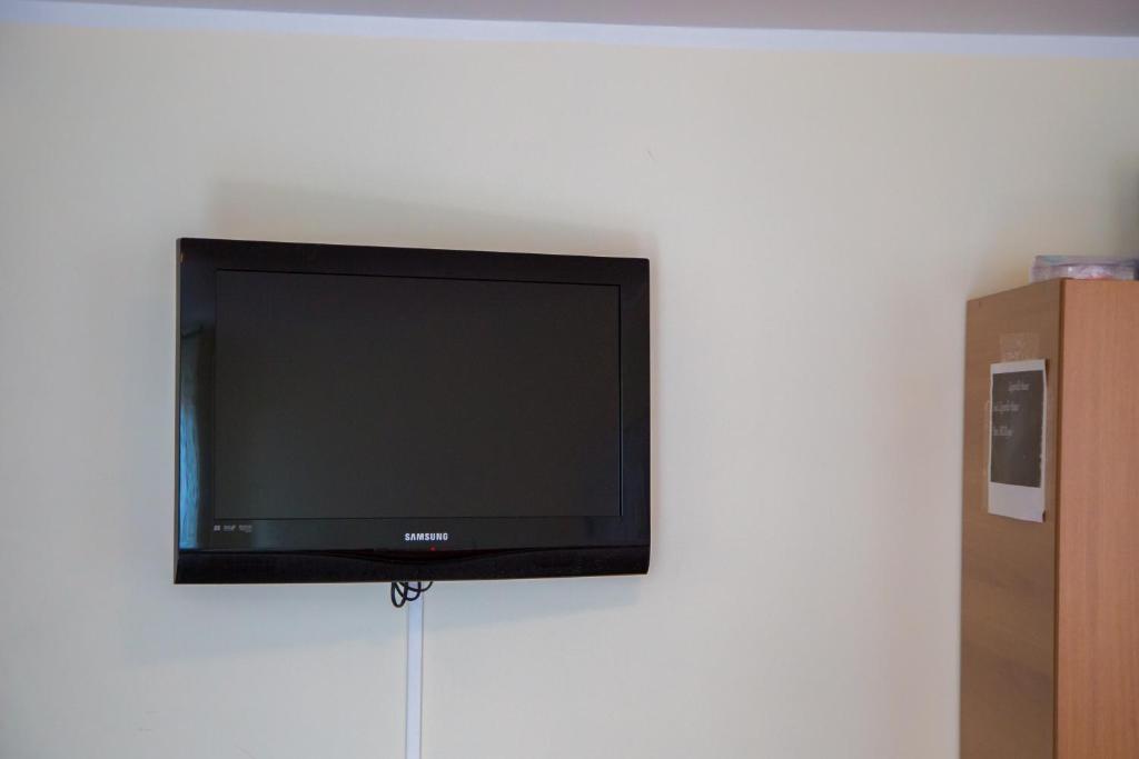 Televízia a/alebo spoločenská miestnosť v ubytovaní Zagarella House