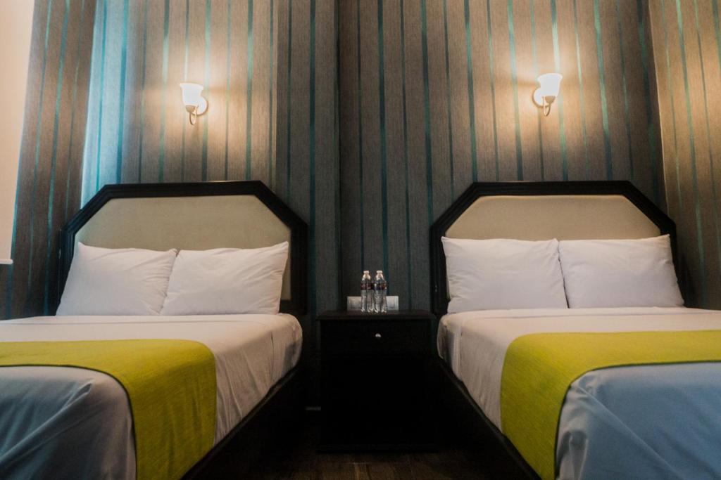 Postel nebo postele na pokoji v ubytování HOTEL CAREYES