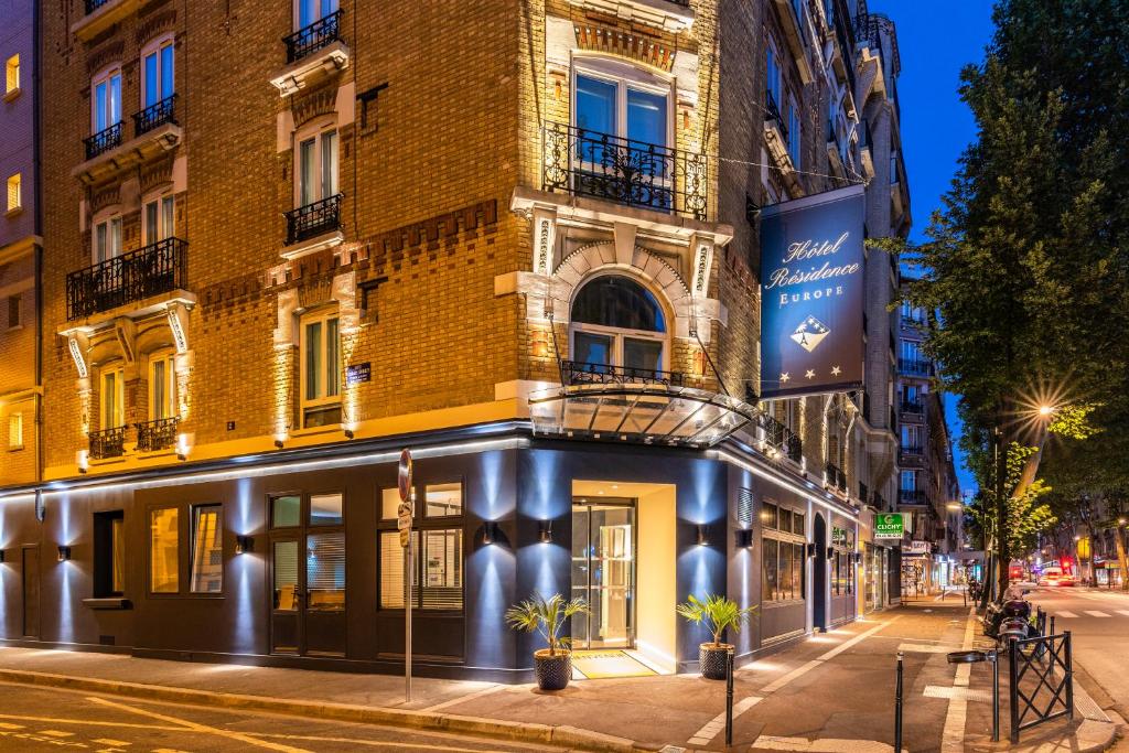 a building on a city street at night at Hotel Residence Europe & Spa in Clichy