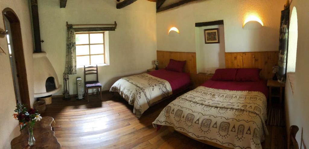 Postel nebo postele na pokoji v ubytování Hostería Hotel Cuello de Luna - Cotopaxi - Country Inn