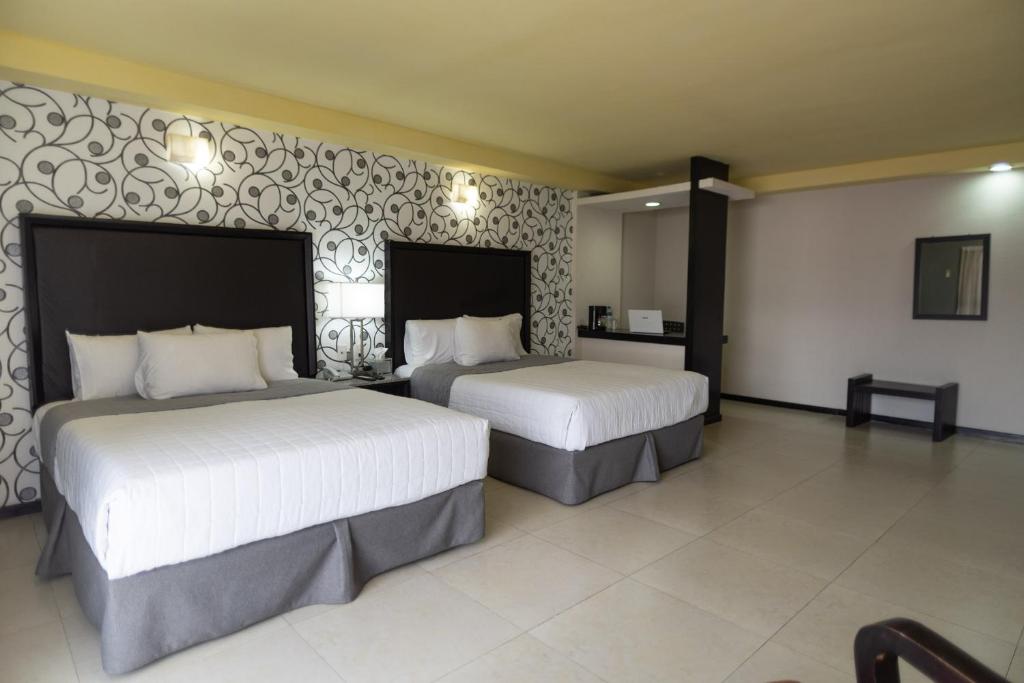 Postel nebo postele na pokoji v ubytování Hotel Ha