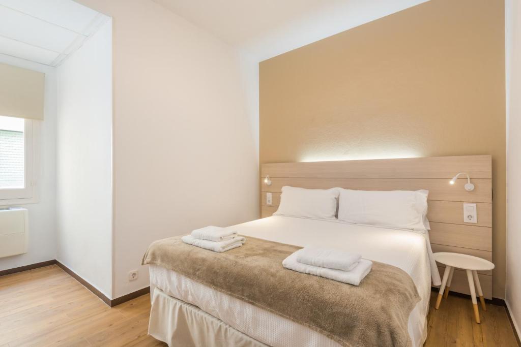 Postel nebo postele na pokoji v ubytování Hostal Jume - Urban Rooms