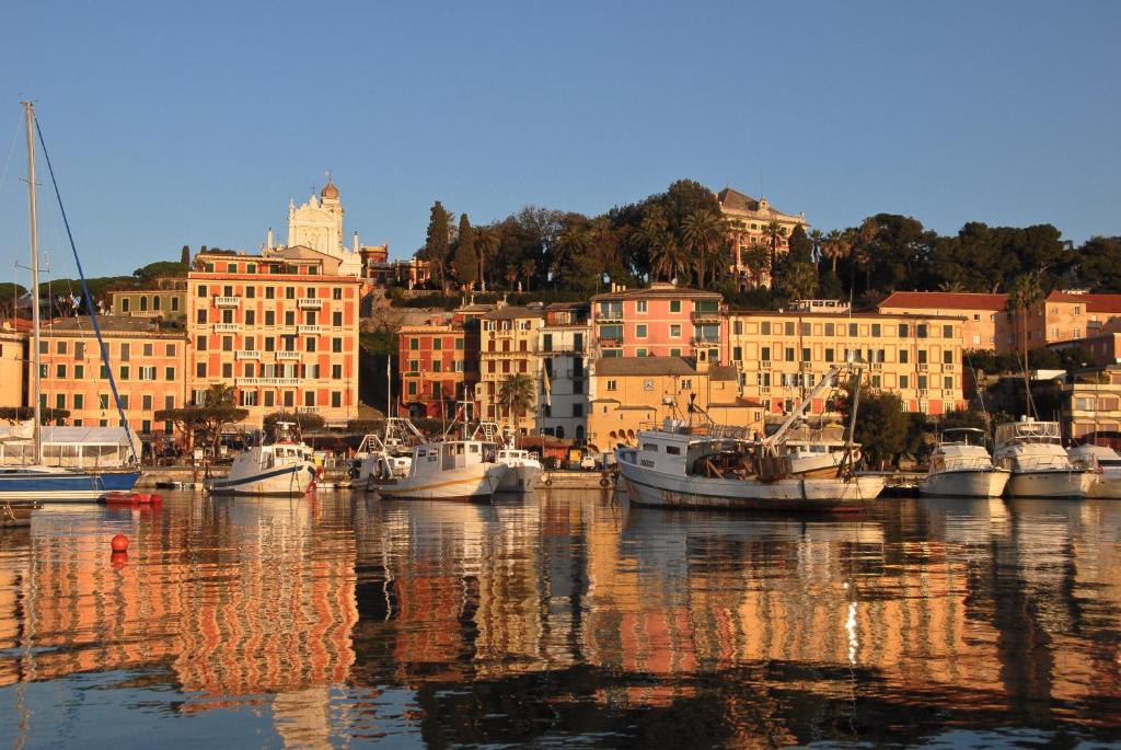a group of boats docked in a harbor with buildings at Albergo Annabella in Santa Margherita Ligure