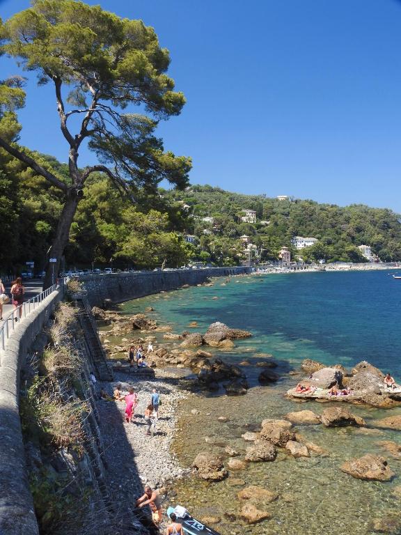 a group of people on a beach near the water at Albergo Annabella in Santa Margherita Ligure