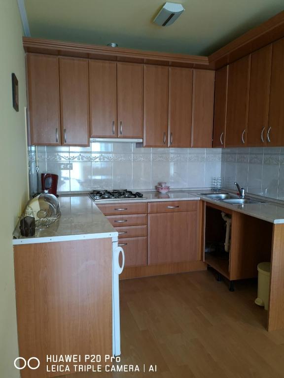 Kuchyňa alebo kuchynka v ubytovaní Vida Apartman