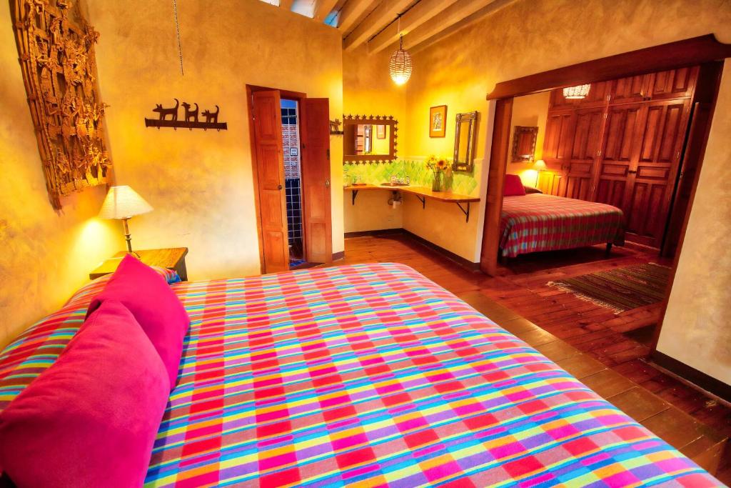Postel nebo postele na pokoji v ubytování Hotel Casa Encantada