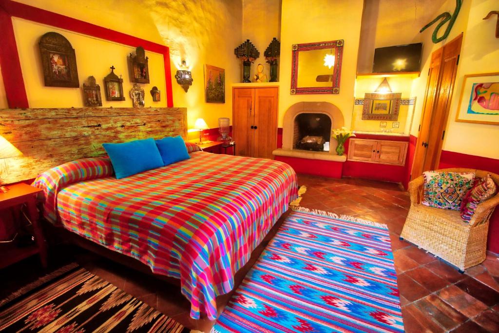 Postel nebo postele na pokoji v ubytování Hotel Casa Encantada