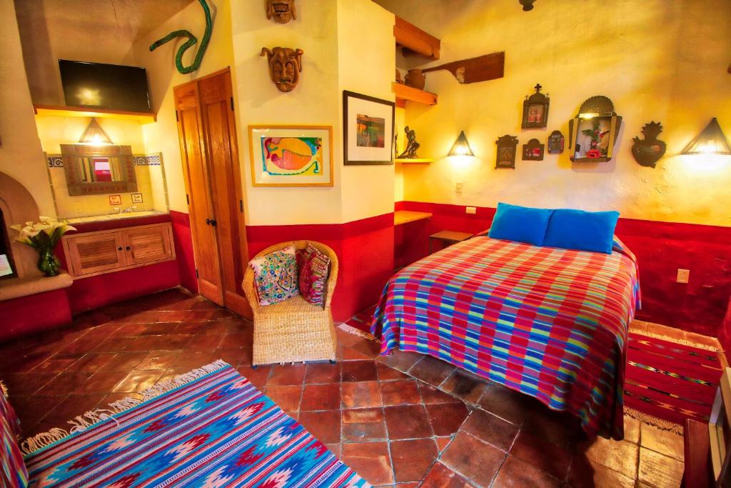 Postel nebo postele na pokoji v ubytování Hotel Casa Encantada