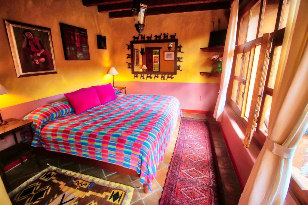 Postel nebo postele na pokoji v ubytování Hotel Casa Encantada