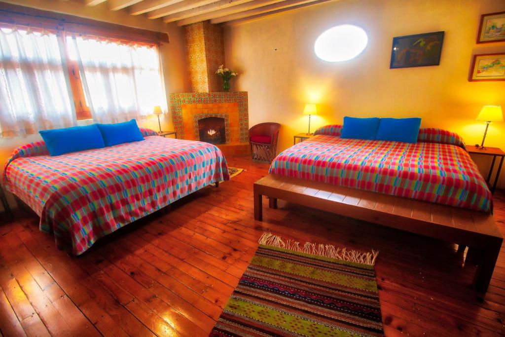 Postel nebo postele na pokoji v ubytování Hotel Casa Encantada