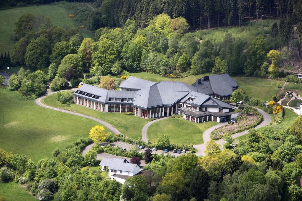 an aerial view of a large house on a hill at Landhaus Nordhelle Garni in Meinerzhagen