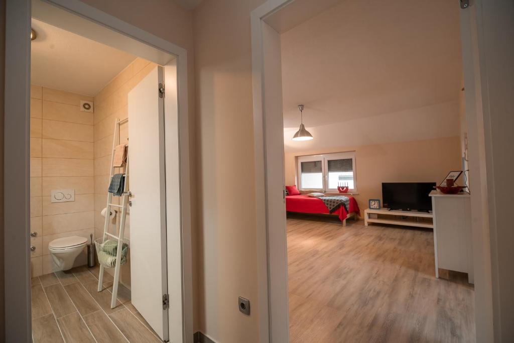 Postel nebo postele na pokoji v ubytování Apartment Stil near Terme Paradiso