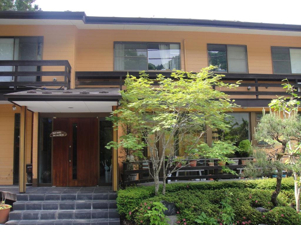 a house with a staircase leading to the front door at Annex Turtle Hotori-An in Nikko