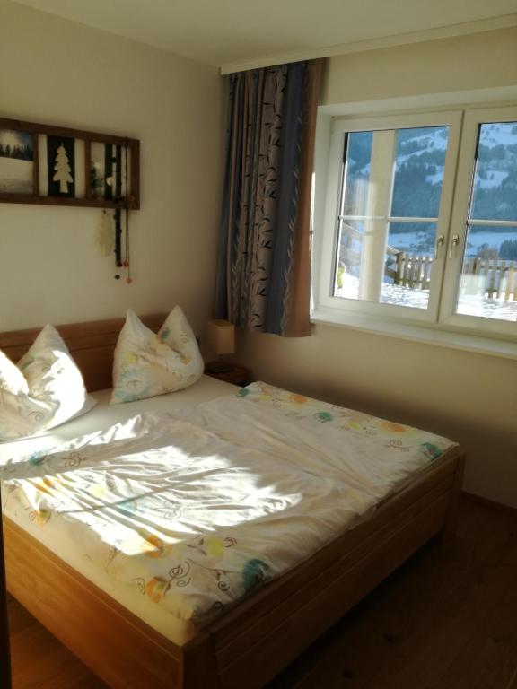 Postel nebo postele na pokoji v ubytování Appartement Alpenglück