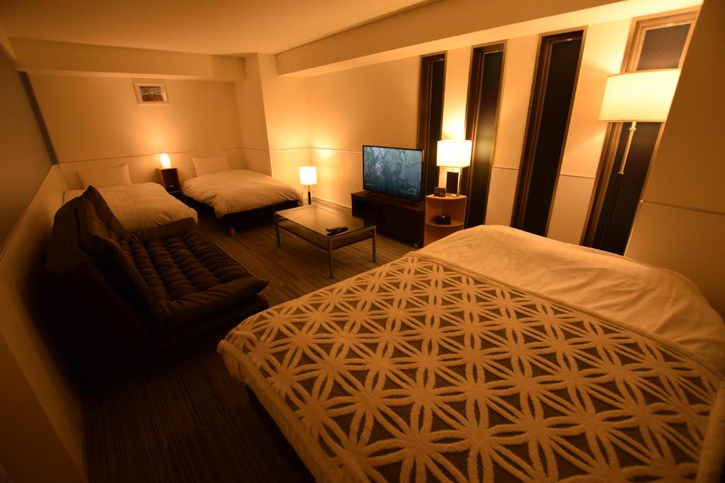 Postel nebo postele na pokoji v ubytování Residence Condominium KALAHAAI