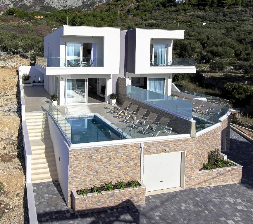 an aerial view of a house with a swimming pool at Villa Karla in Makarska