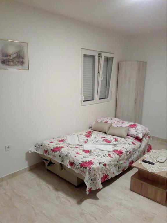 Postel nebo postele na pokoji v ubytování Apartmani M&V