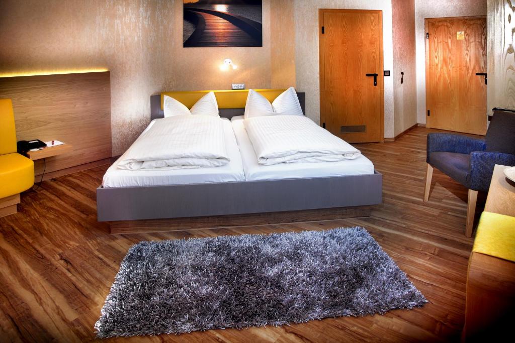 Postel nebo postele na pokoji v ubytování Hotel Luisen Mühle