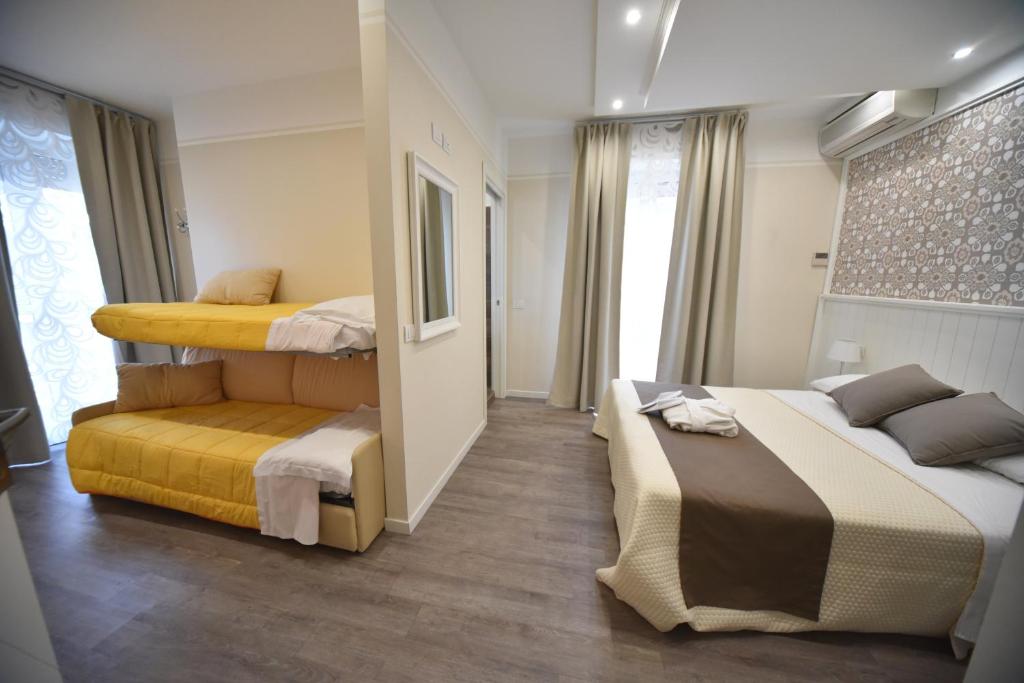 Postel nebo postele na pokoji v ubytování Hotel Villa Edda