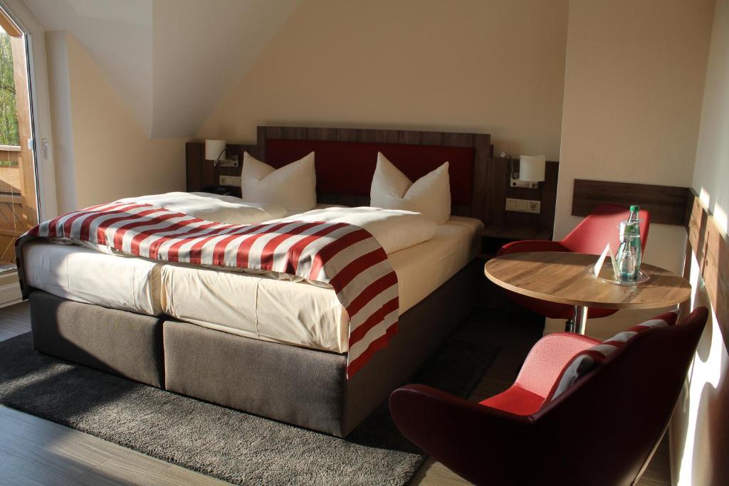 Postel nebo postele na pokoji v ubytování Hotel Knorre