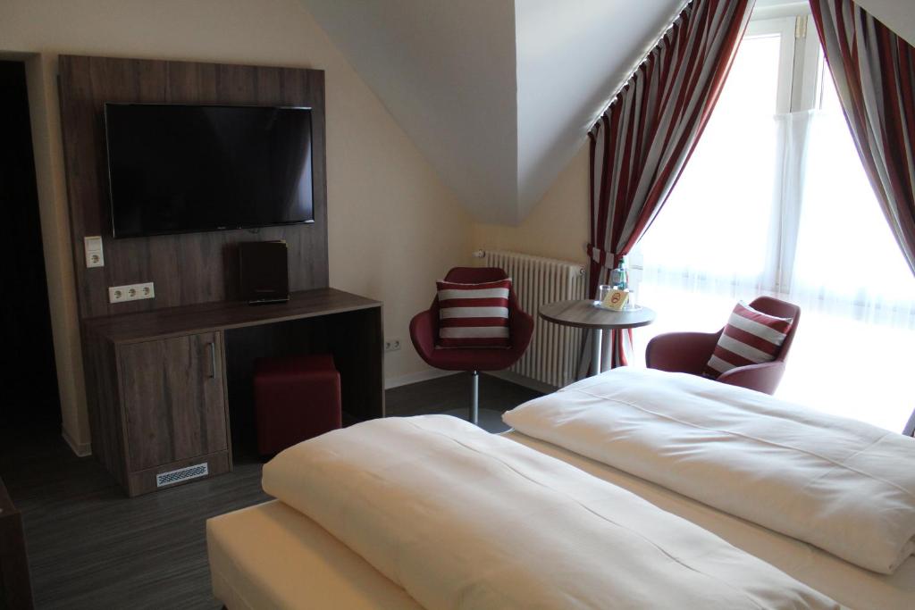 Postel nebo postele na pokoji v ubytování Hotel Knorre
