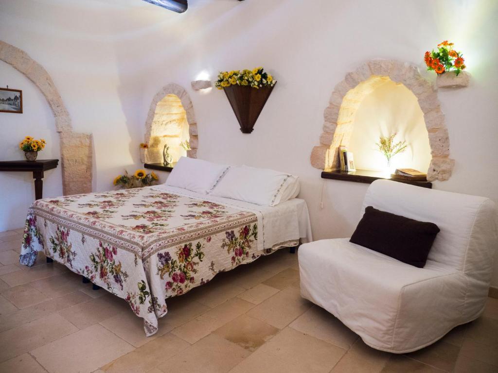 Postel nebo postele na pokoji v ubytování Trulli Barsento