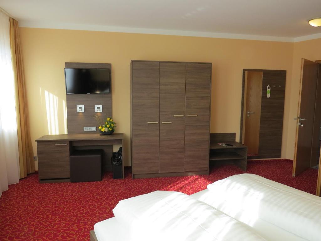Postel nebo postele na pokoji v ubytování ates Hotel Lampertheim by AURUM