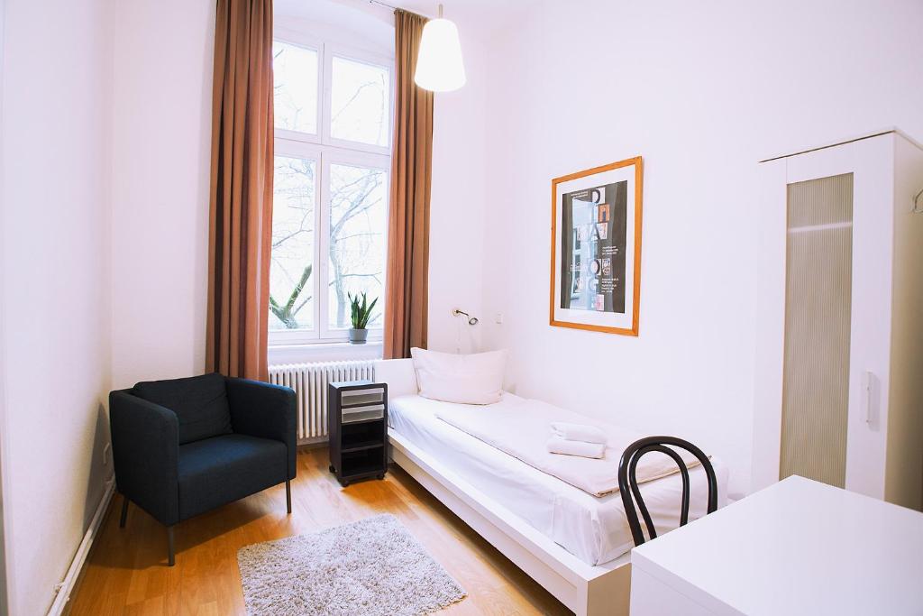 Postel nebo postele na pokoji v ubytování Pension Peters – Das andere Hotel