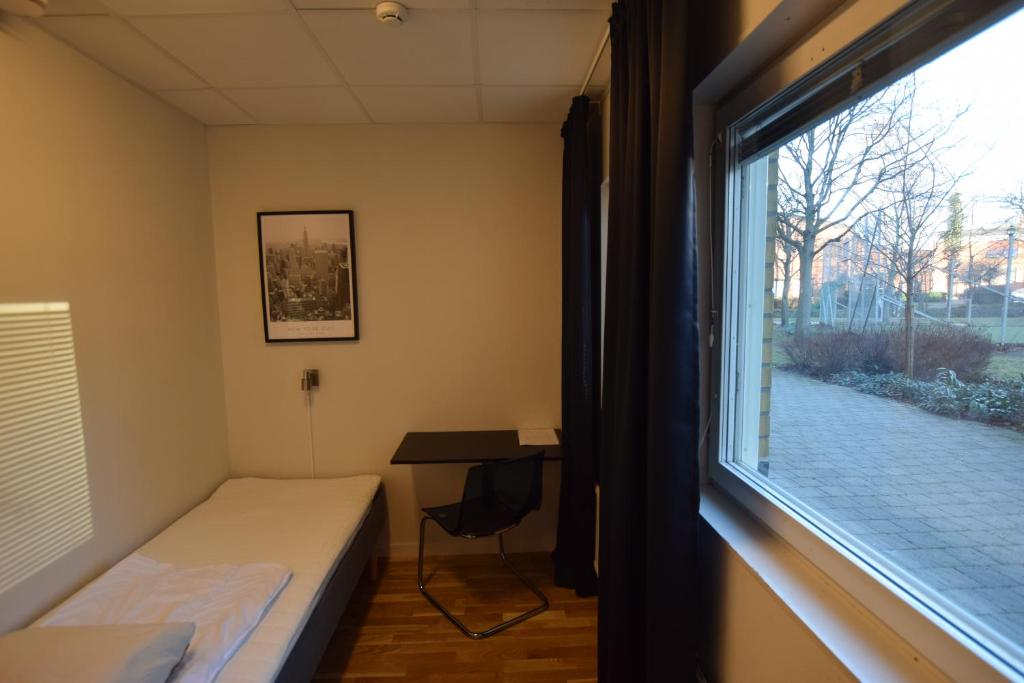 Postel nebo postele na pokoji v ubytování Hostel Snoozemore