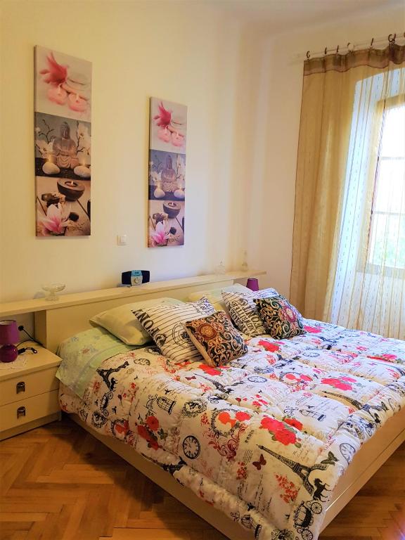 Łóżko lub łóżka w pokoju w obiekcie Noemi City Apartments