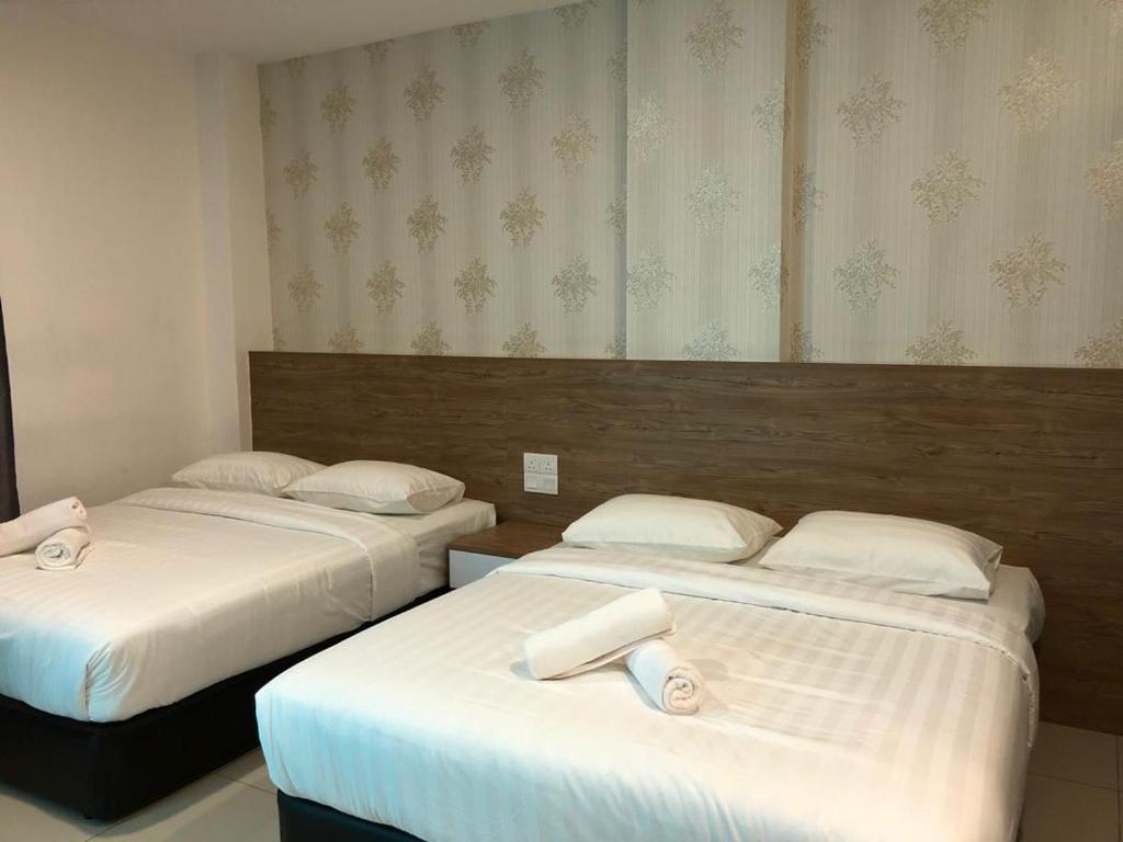 Postel nebo postele na pokoji v ubytování KU-3 HOTEL