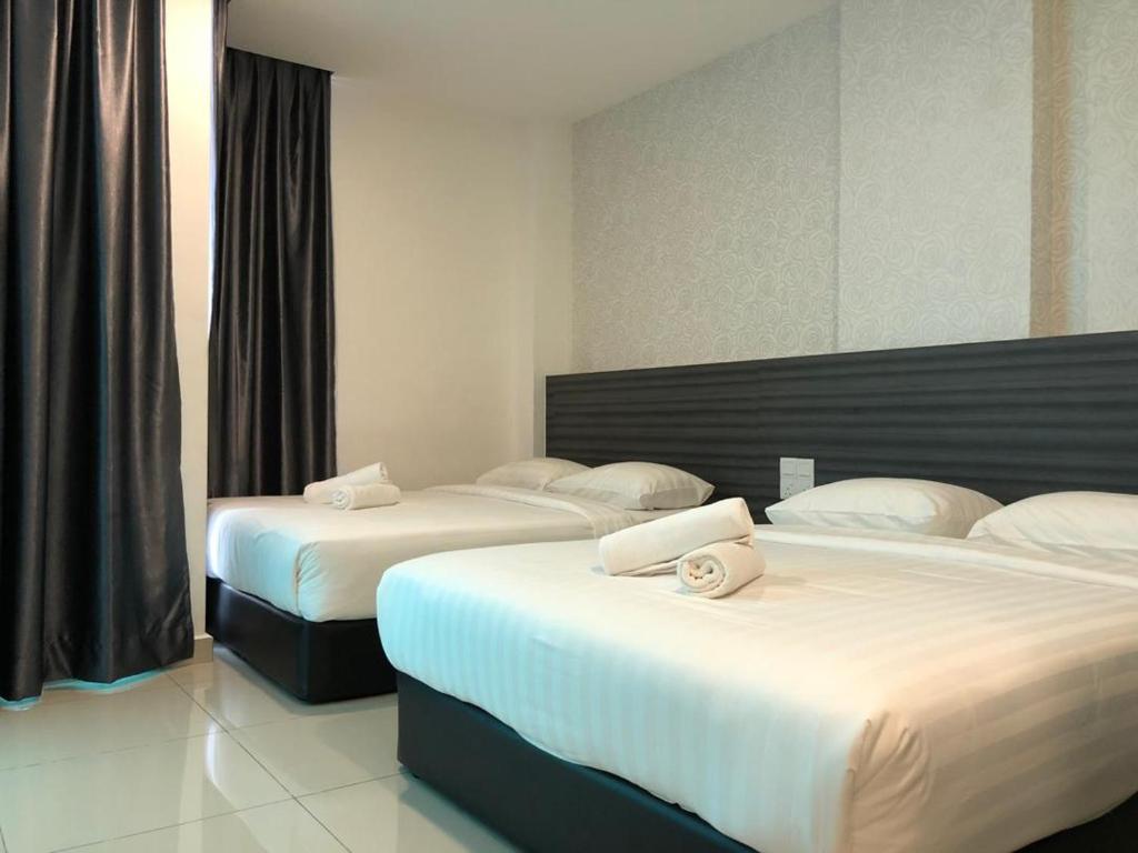 Postel nebo postele na pokoji v ubytování KU-3 HOTEL