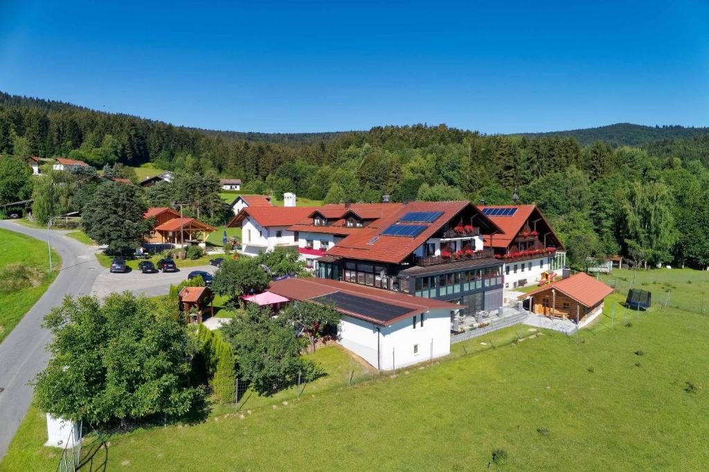 an overhead view of a large house with red roofs at Hotel Hirschenstein in Achslach
