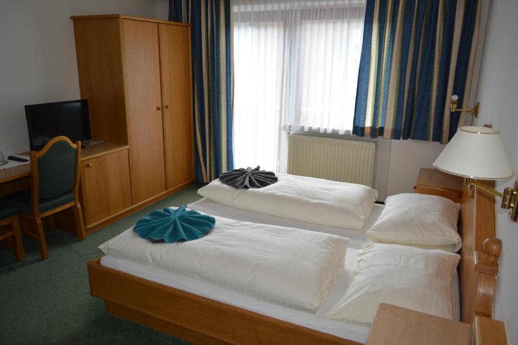 Postel nebo postele na pokoji v ubytování Frühstückspension Christina