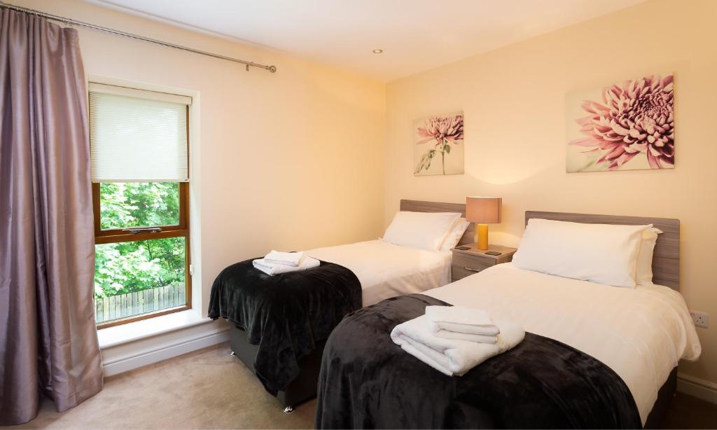 Ein Bett oder Betten in einem Zimmer der Unterkunft Tewitfield Marina