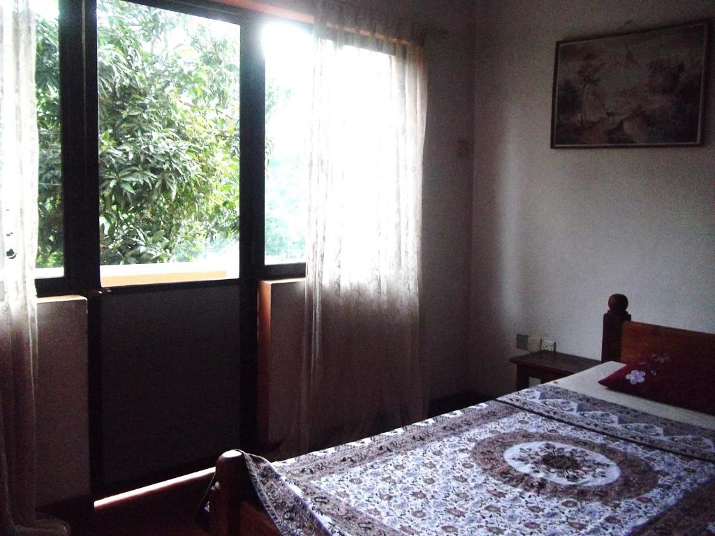 Postel nebo postele na pokoji v ubytování Majestic Tourist Hotel