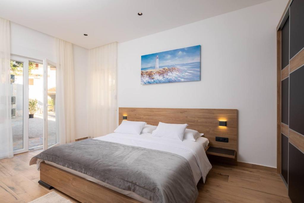 Posteľ alebo postele v izbe v ubytovaní Beachfront Luxury Villa