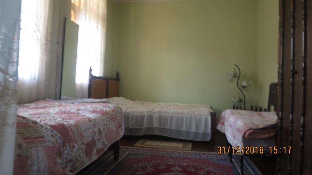 Postel nebo postele na pokoji v ubytování Guest House Gio