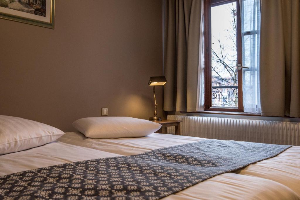 Postel nebo postele na pokoji v ubytování Hotel Beysang