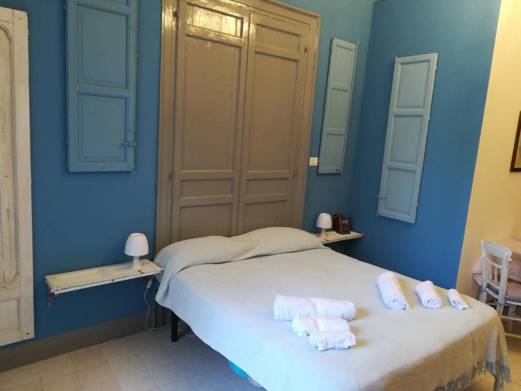 En eller flere senge i et værelse på casa in palazzo Graffeo Veronica